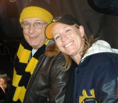 My dad and I at a Mizzou football game repping Notre Dame.